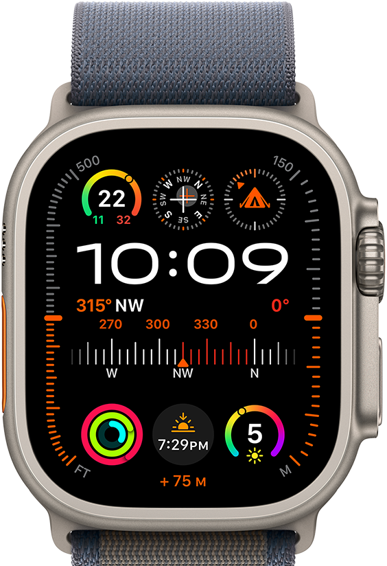 Apple Watch Ultra 2 shown attached to blue Alpine Loop, displaying watch face with complications including GPS, temperature, compass, altitude, and fitness metrics